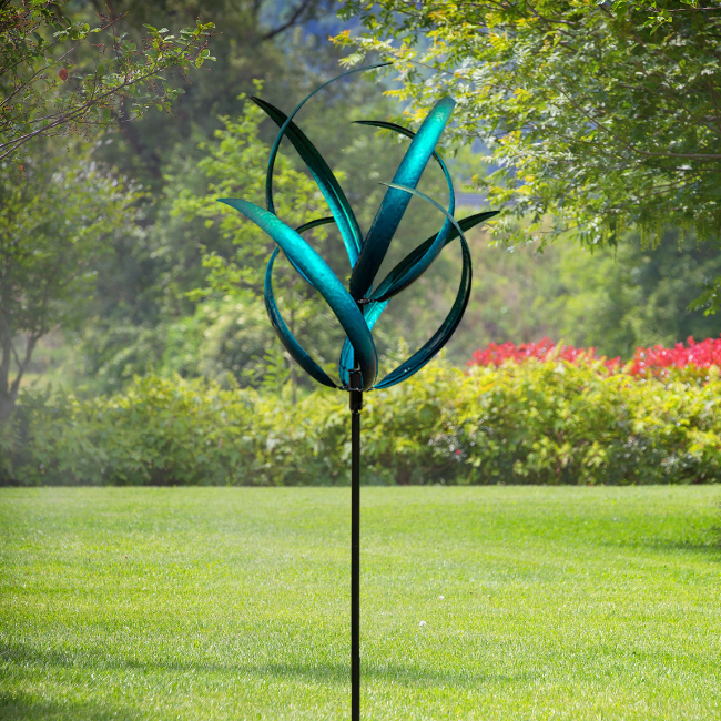 Marshall Caribbean Kinetic Cheyenne Wind Spinner – Dual-level, curved blades in emerald green and deep aqua create a mesmerizing motion. Sealed ball bearings ensure smooth spinning. Sturdy steel pole with black powder-coated finish and stabilizing feet for secure installation. 21" dia. x 87"H. Perfect for adding vibrant movement to any garden.